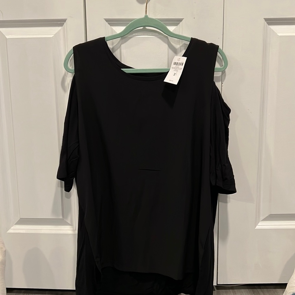 NWT Chico’s open shoulder top in black.  Size 3 (us 14-16)